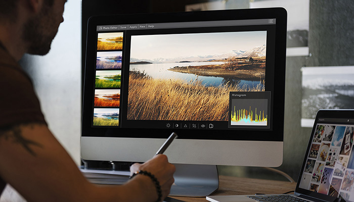 Man editing photos on a computer